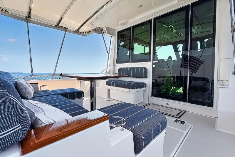 Slide: The Image of 2024 Back Cove 39O yacht with elegant seating solid enclosure and Custom Stamoid  Cockpit Cover - 9