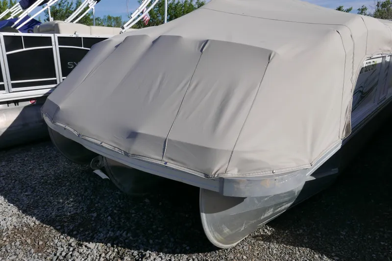 Slide: The Image of Covered 2008 JC SunToon 21TT pontoon boat on gravel surface. - 13