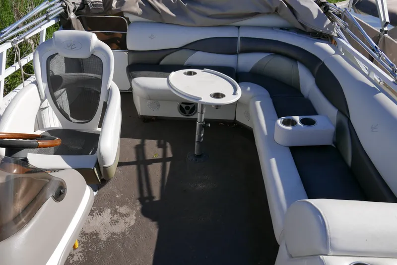 Slide: The Image of Interior of a 2008 JC SunToon 21TT pontoon boat with seating and table. - 8