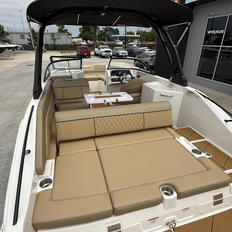 Slide: The Image of Interior of 2025 Bayliner D22I with beige seating and table. - 11