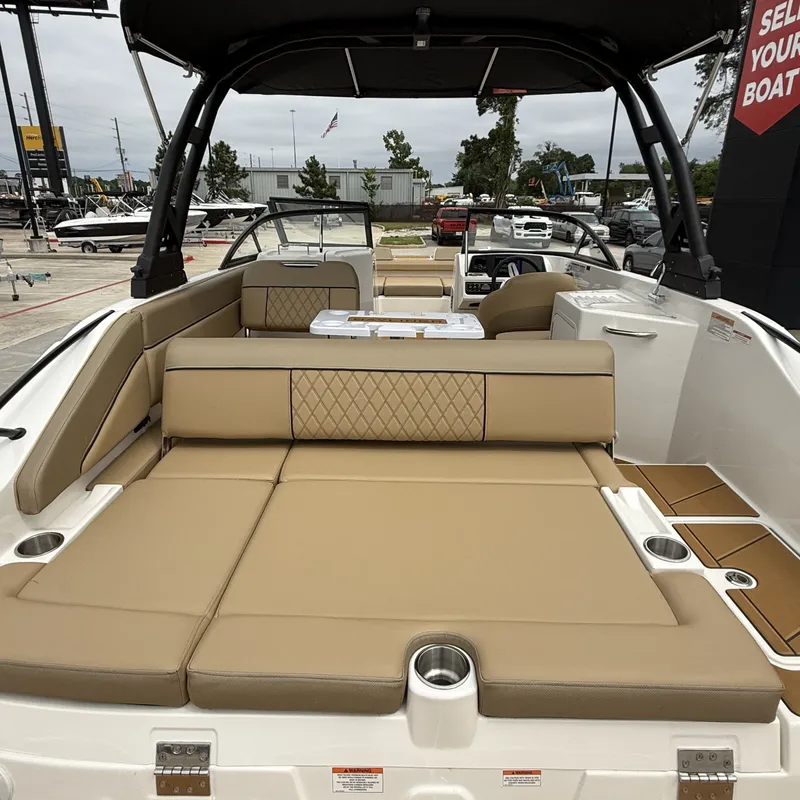 Slide: The Image of Interior view of 2025 Bayliner D22I with beige upholstery. - 12