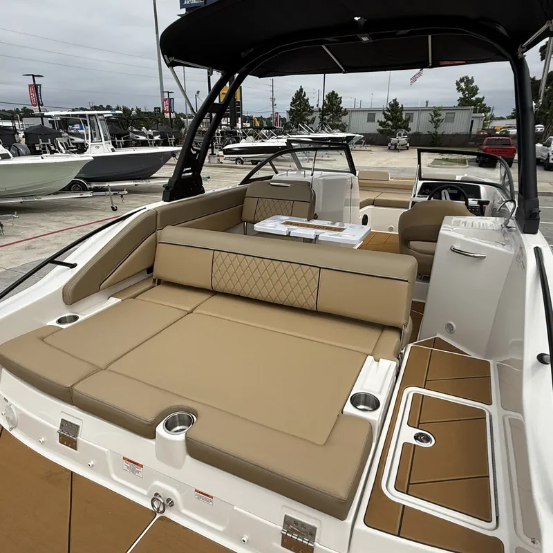 Slide: The Image of Interior view of 2025 Bayliner D22I with beige upholstery. - 13