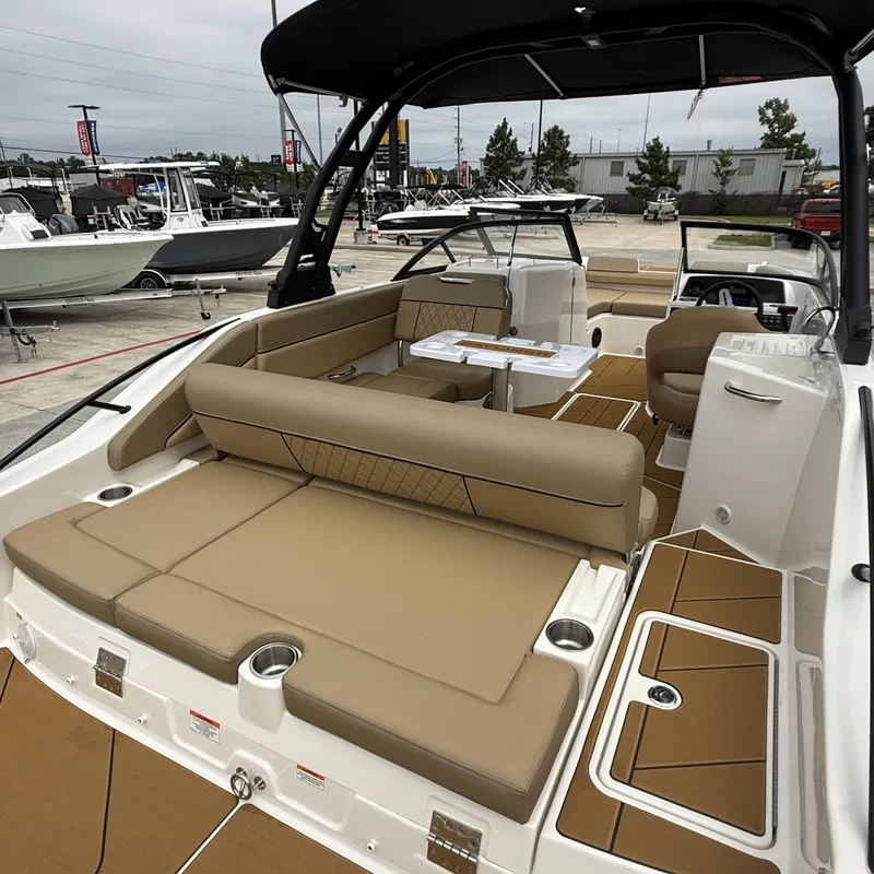 Slide: The Image of Interior of 2025 Bayliner D22I with beige seating and table. - 14