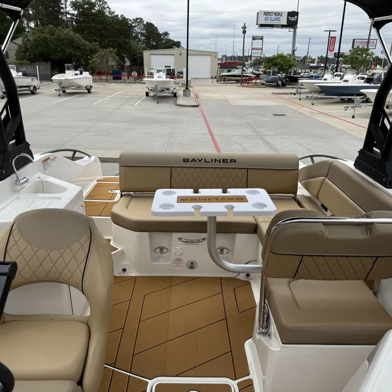 Slide: The Image of Interior of 2025 Bayliner D22I with seating area and table. - 18