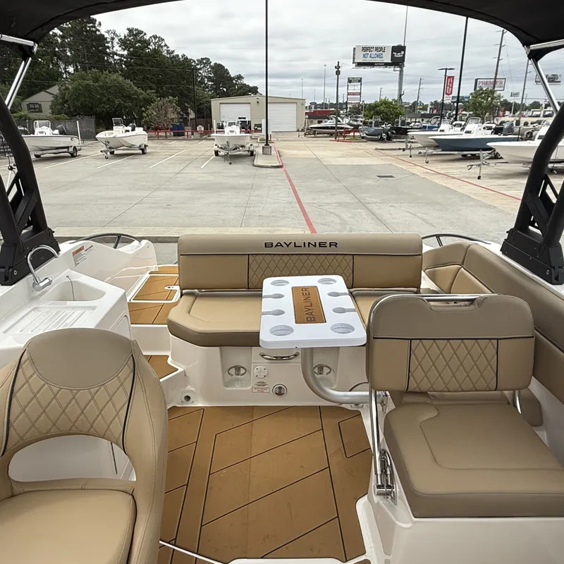 Slide: The Image of Interior of 2025 Bayliner D22I with luxurious seating and table. - 19