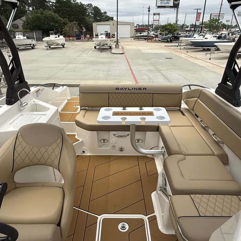 Slide: The Image of Interior of 2025 Bayliner D22I with beige seating and table. - 20