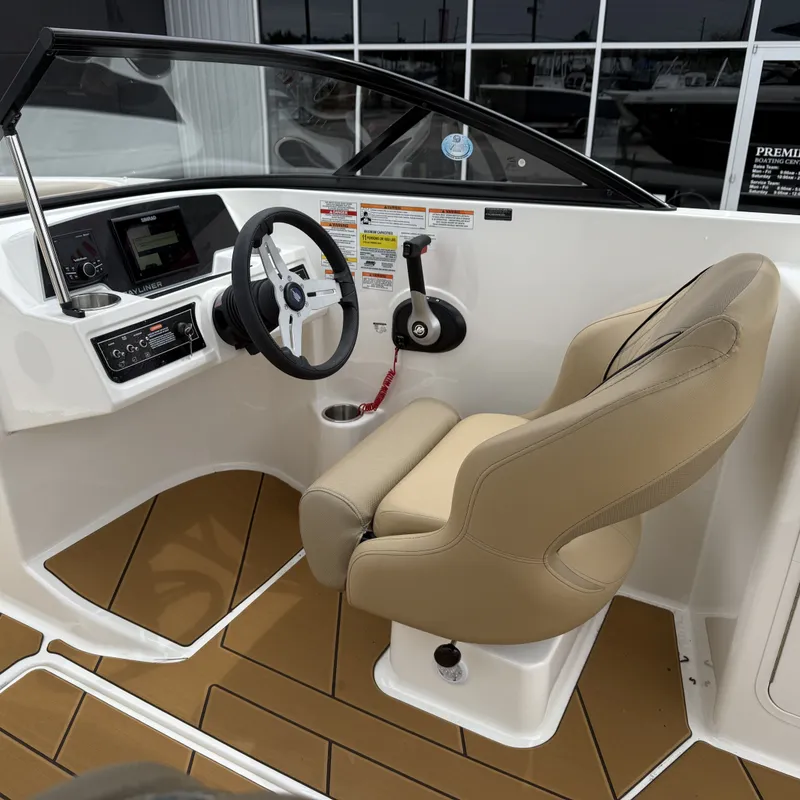 Slide: The Image of Interior of 2025 Bayliner D22I with steering console and seat. - 21