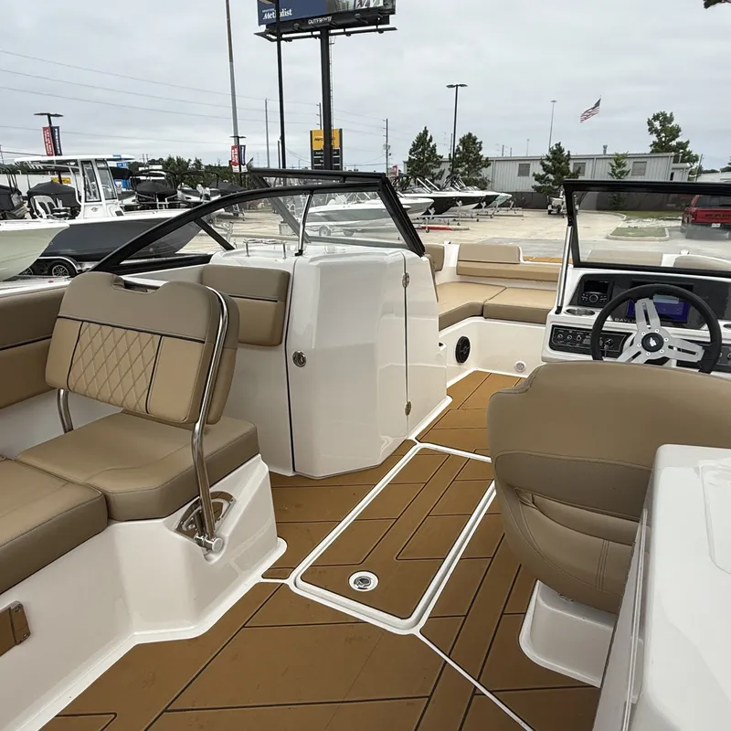 Slide: The Image of Interior of 2025 Bayliner D22I with beige seating and modern design. - 22