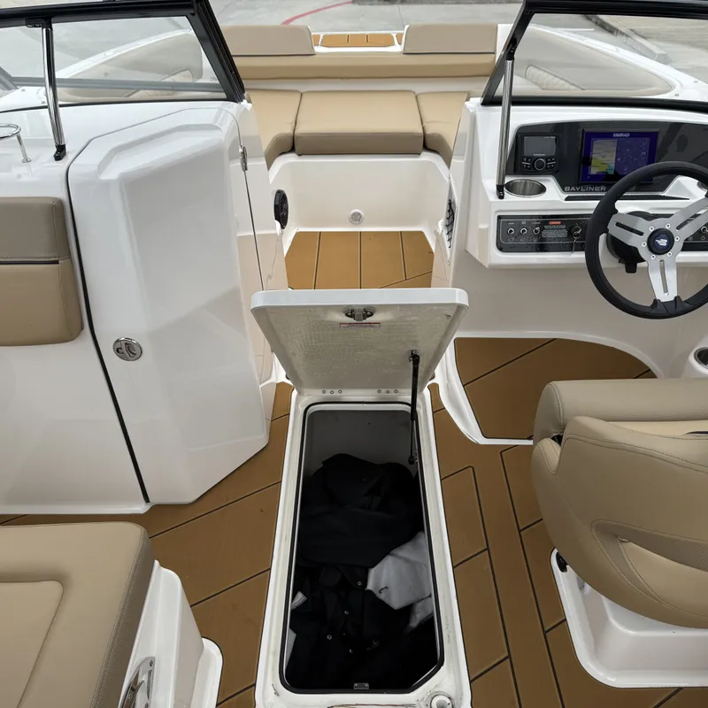 Slide: The Image of Interior of 2025 Bayliner D22I with storage and helm console. - 29