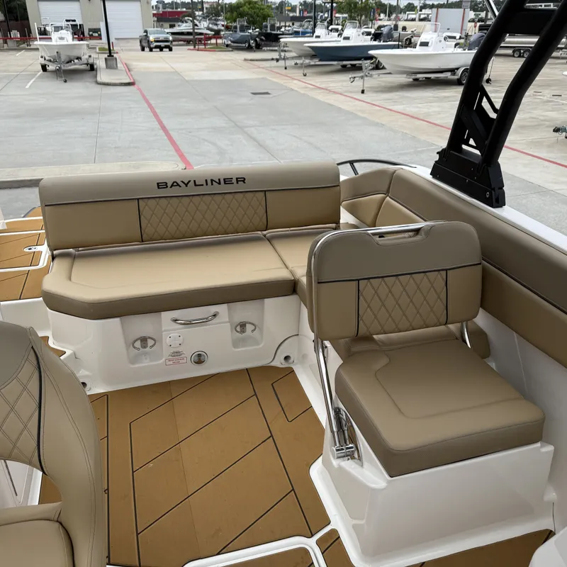 Slide: The Image of Interior of 2025 Bayliner D22I with beige seating. - 30