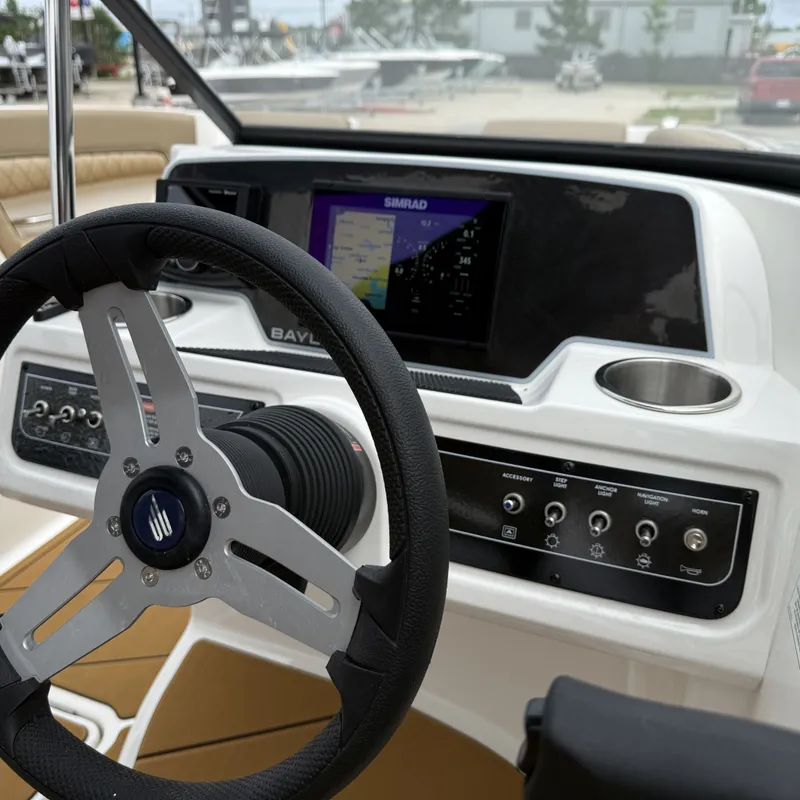 Slide: The Image of Bayliner D22I 2025 helm with Simrad navigation system. - 34