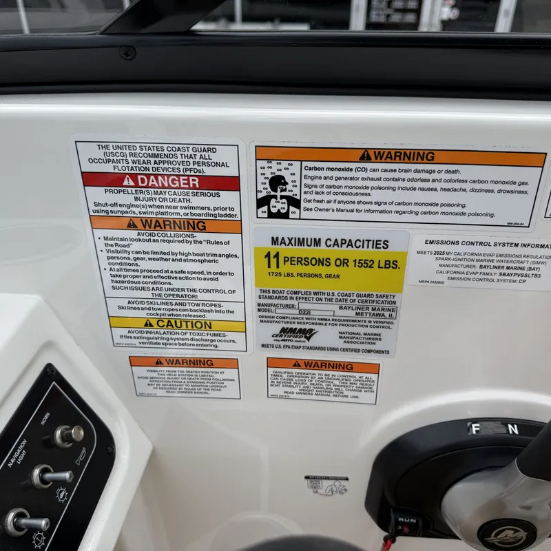Slide: The Image of Warning labels and capacity chart on Bayliner D22I boat, year 2025. - 36