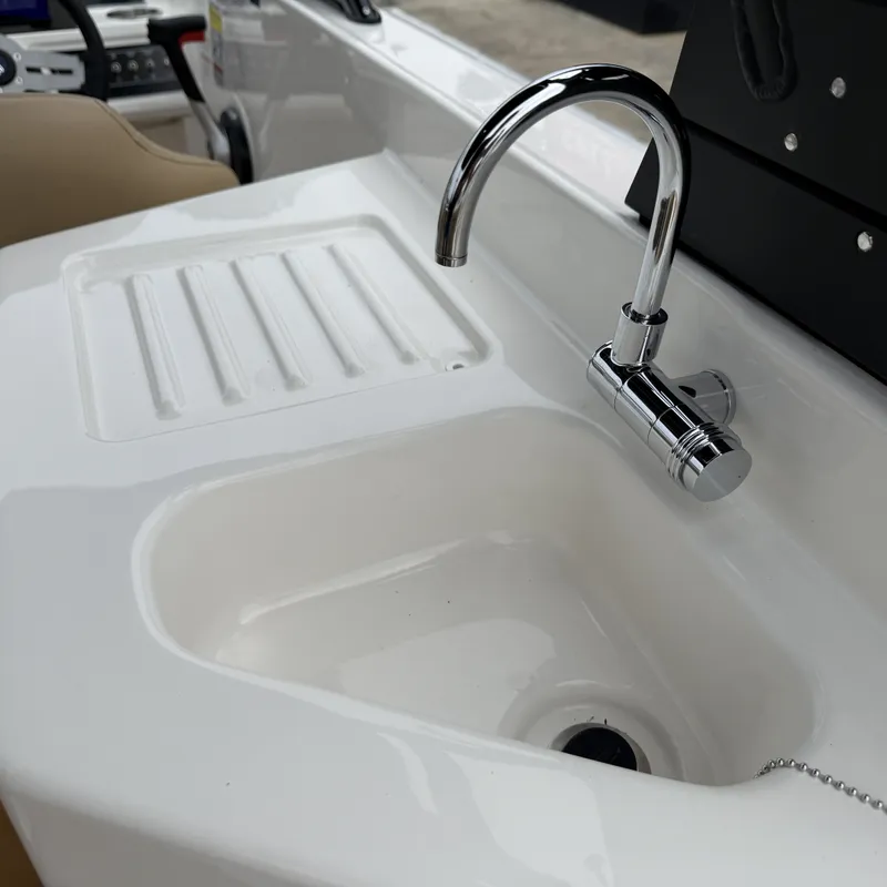 Slide: The Image of Bayliner D22I 2025 boat kitchenette with sink and faucet. - 40