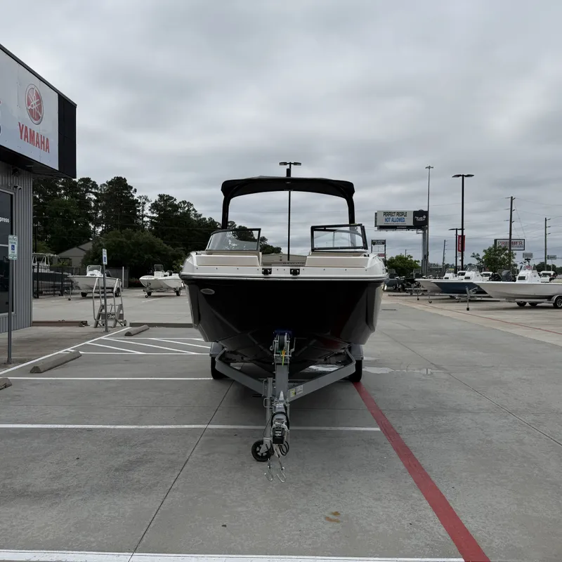 Slide: The Image of 2025 Bayliner D22I boat parked outside a Yamaha dealership. - 5