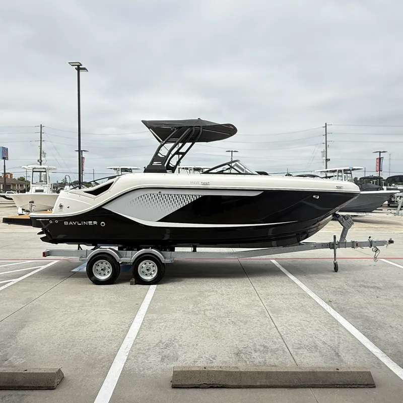 Slide: The Image of 2025 Bayliner D22I boat on trailer outdoors. - 7