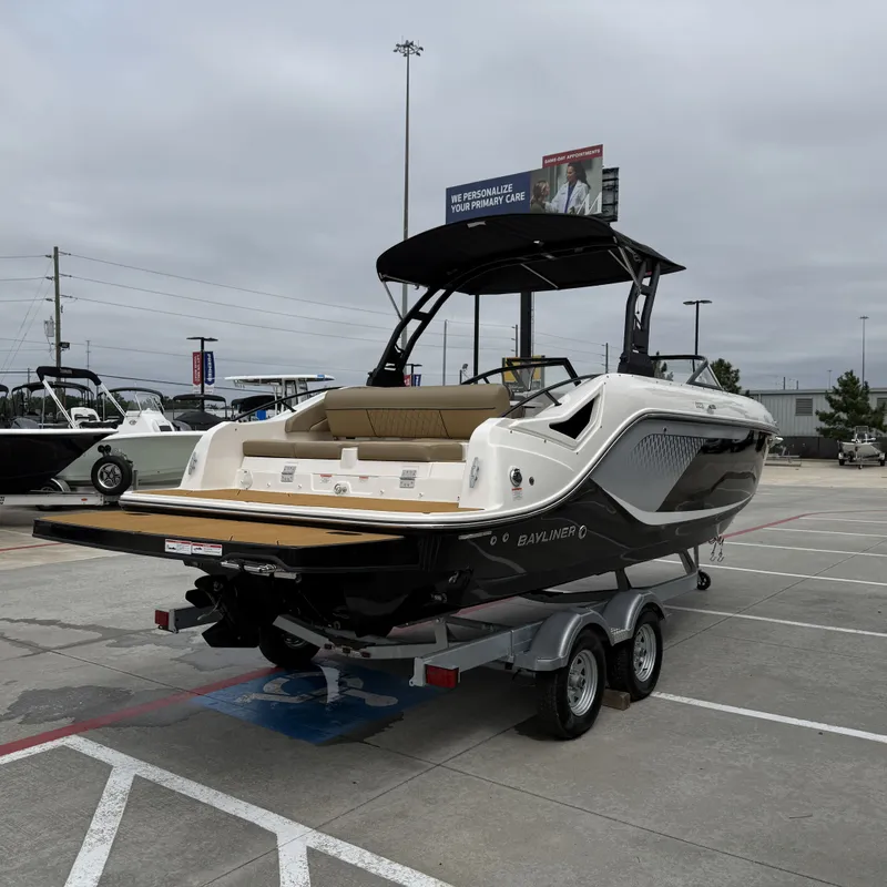 Slide: The Image of 2025 Bayliner D22I boat parked on trailer outdoors. - 8