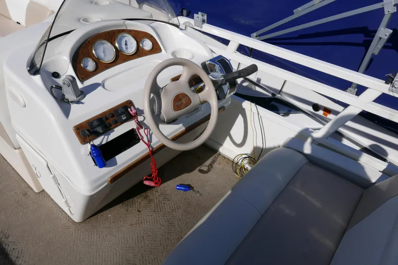 Slide: The Image of 2008 Bentley Pontoons 200 CRUISE boat dashboard with steering wheel and control panel. - 10