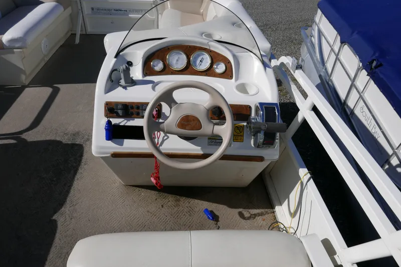 Slide: The Image of 2008 Bentley Pontoons 200 CRUISE dashboard with steering wheel and gauges. - 11