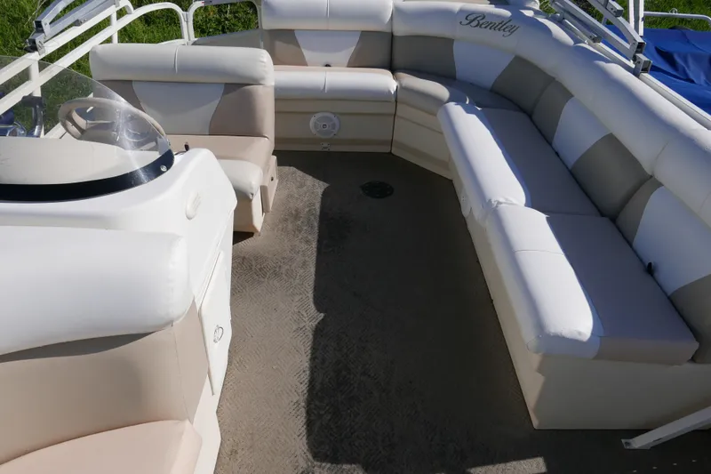 Slide: The Image of 2008 Bentley Pontoons 200 CRUISE interior with plush seating and steering console. - 9