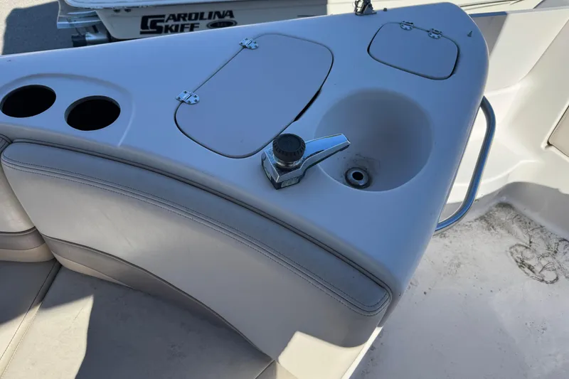 Slide: The Image of 1997 Chaparral 232 Sunesta boat interior with sink and cup holders. - 13