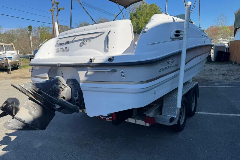 Slide: The Image of 1997 Chaparral 232 Sunesta boat on trailer, rear view, parked outdoors. - 16