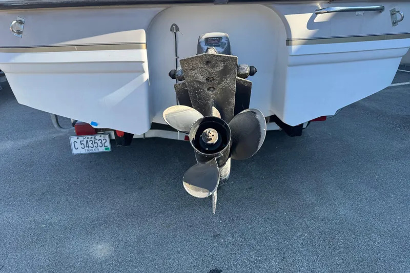 Slide: The Image of 1997 Chaparral 232 Sunesta boat stern with propeller and Maine trailer license plate. - 17