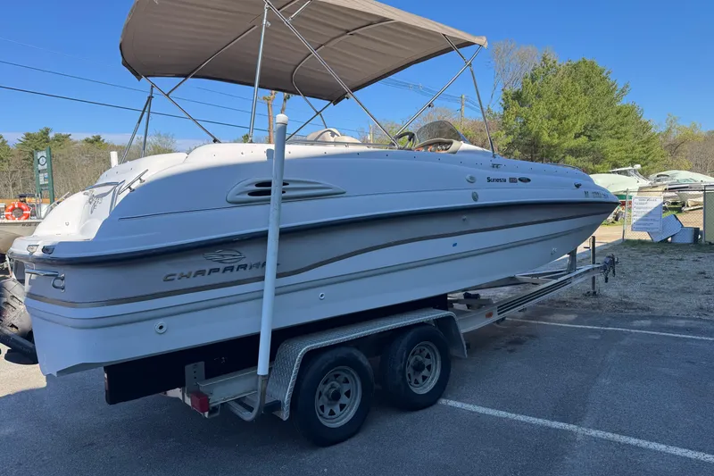 Slide: The Image of 1997 Chaparral 232 Sunesta boat on trailer with canopy, parked outdoors. - 3