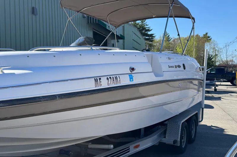 Slide: The Image of 1997 Chaparral 232 Sunesta boat on trailer with canopy, parked outdoors. - 4