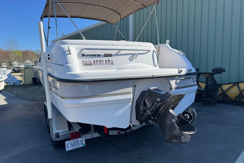 Slide: The Image of 1997 Chaparral 232 Sunesta boat with trailer, parked outdoors. - 6