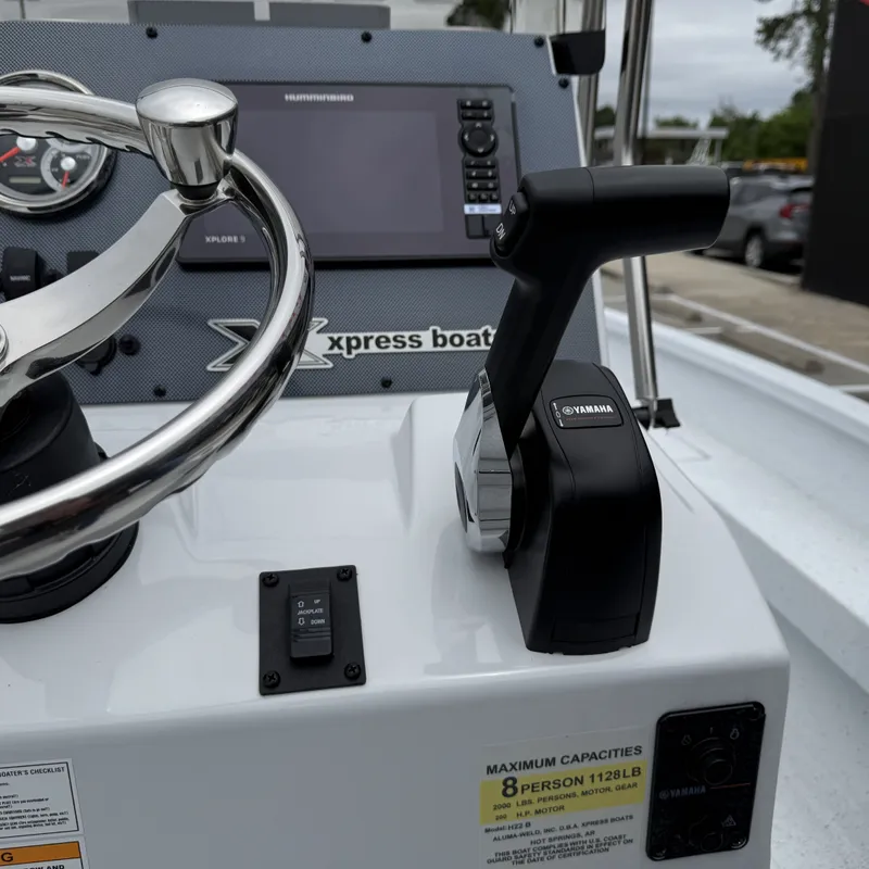 Slide: The Image of Xpress H22BAY 2026 boat console with Yamaha throttle control. - 14
