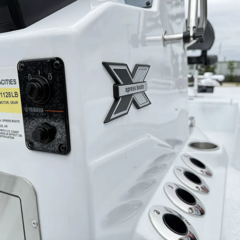 Slide: The Image of Close-up of Xpress H22BAY 2026 boat with Yamaha control panel. - 15