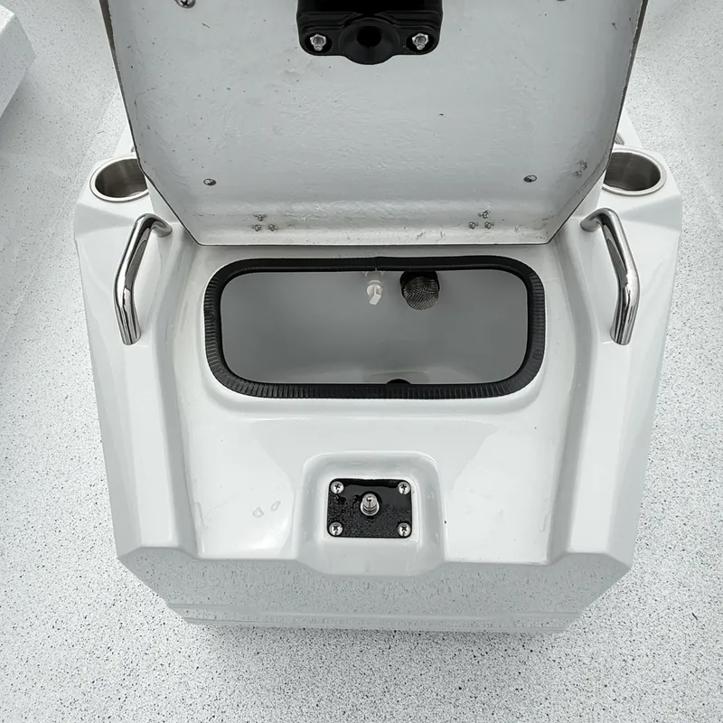 Slide: The Image of Open storage compartment in Xpress H22BAY boat, model 2026. - 17