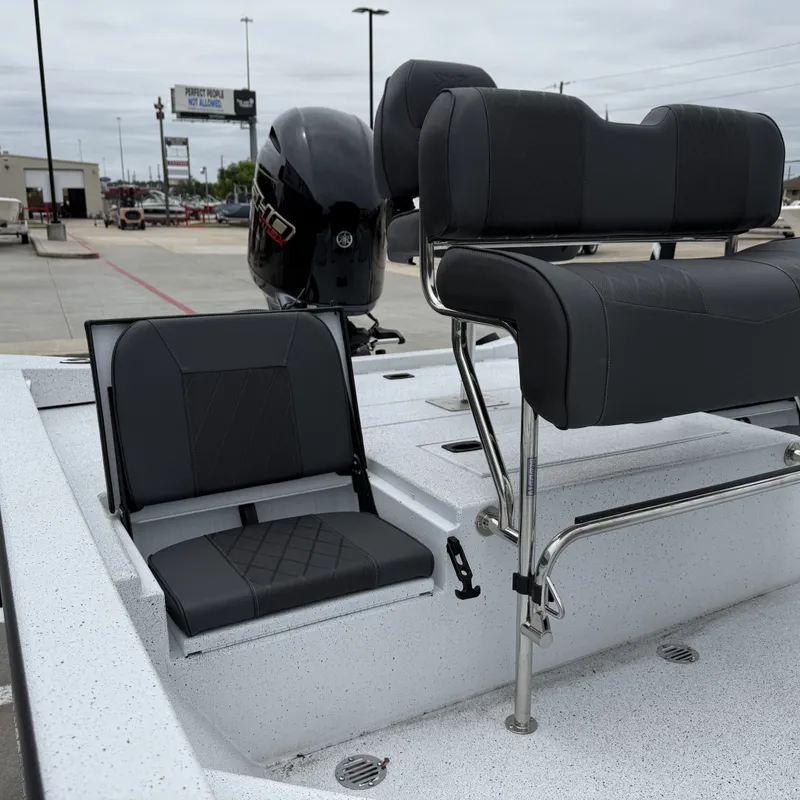 Slide: The Image of Xpress H22BAY 2026 boat with gray seats and outboard motor. - 18
