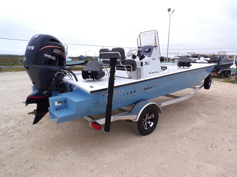 Slide: The Image of 2026 Xpress SW20B boat with Yamaha engine on trailer. - 12