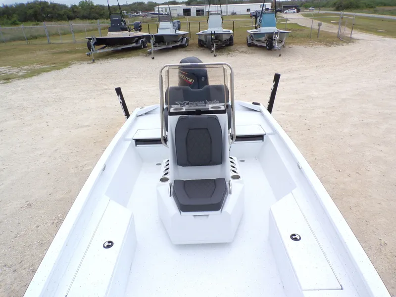 Slide: The Image of 2026 Xpress SW20B boat on a parking lot. - 16
