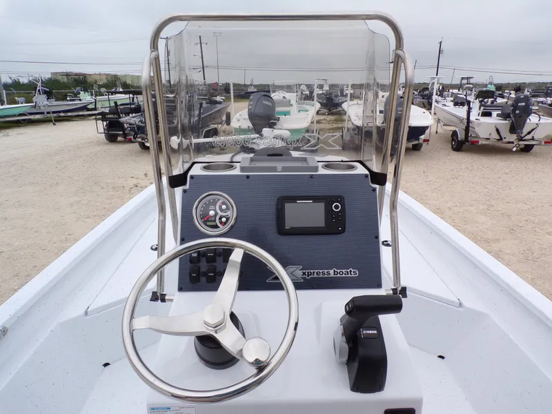 Slide: The Image of Xpress SW20B boat console, 2026 model, featuring steering wheel and controls. - 20