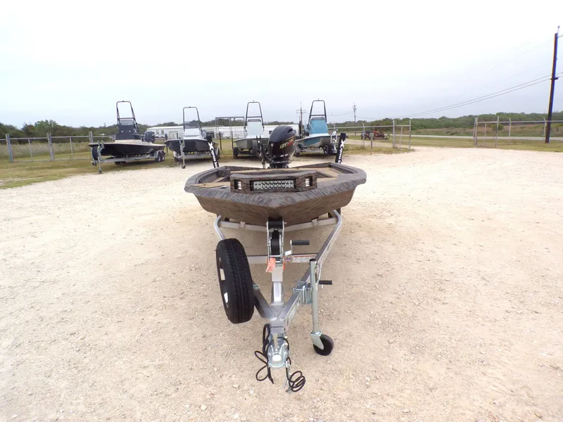 Slide: The Image of 2026 Xpress X18DB boat on trailer in an outdoor lot. - 12