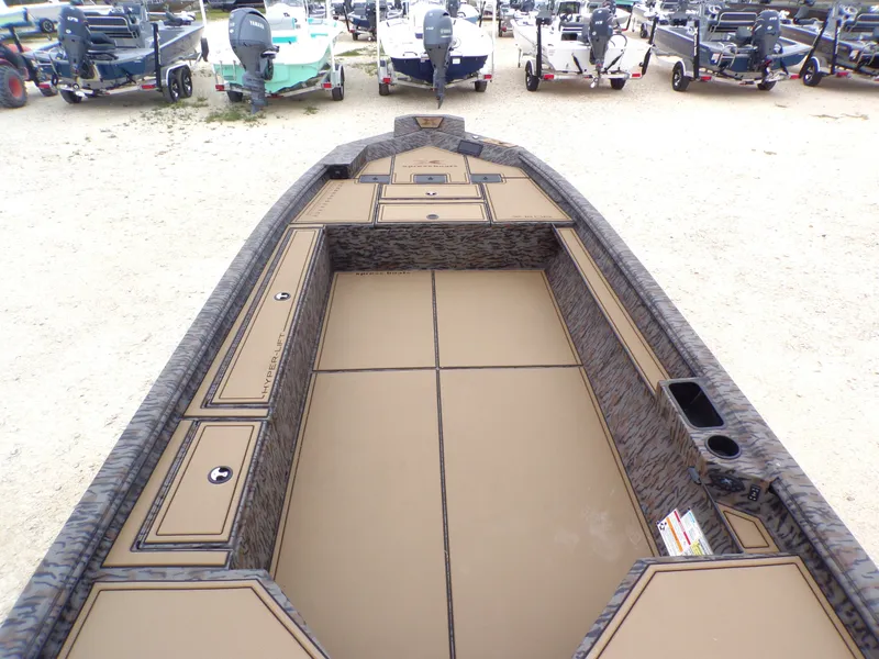 Slide: The Image of Interior view of Xpress X18DB boat, 2026 model, in a parking lot. - 5