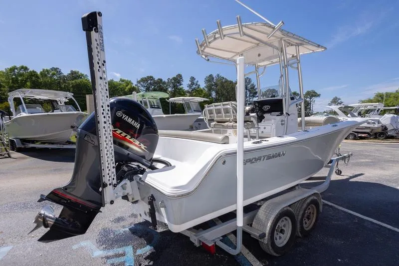 Slide: The Image of 2021 Sportsman Heritage 211 Center Console boat on trailer, featuring Yamaha outboard motor. - 19