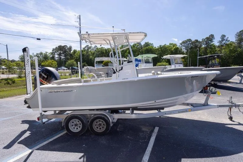 Slide: The Image of 2021 Sportsman Heritage 211 Center Console boat on trailer in parking lot. - 20