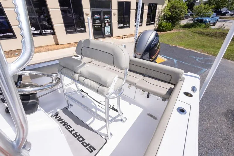 Slide: The Image of 2021 Sportsman Heritage 211 Center Console boat interior with seating and steering wheel. - 21