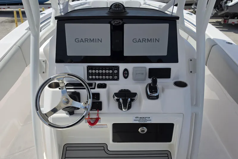 Slide: The Image of 2023 Sea Fox 288 Commander helm with dual Garmin displays and modern controls. - 11