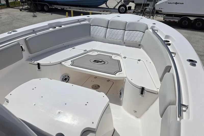 Slide: The Image of 2023 Sea Fox 288 Commander boat interior with cushioned seating and storage compartments. - 13