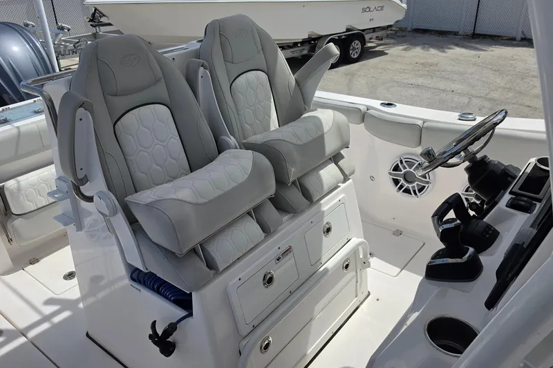 Slide: The Image of 2023 Sea Fox 288 Commander boat interior with dual captain seats and steering console. - 14