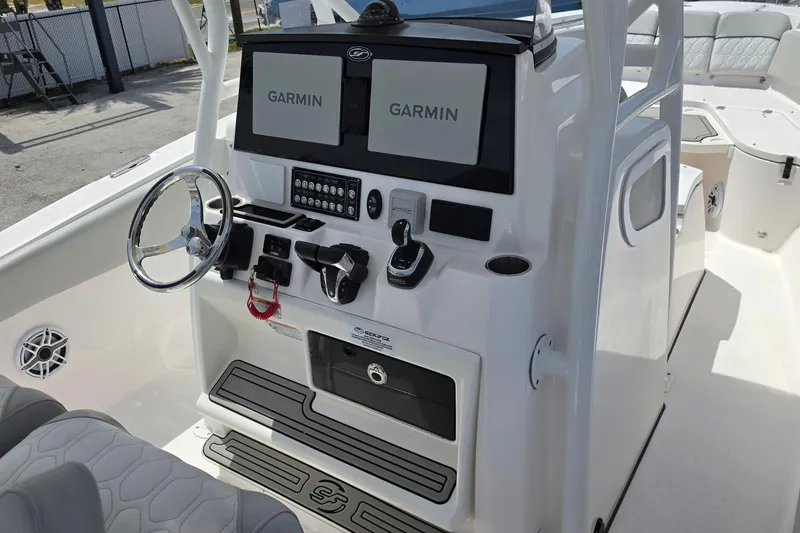 Slide: The Image of 2023 Sea Fox 288 Commander boat console with dual Garmin displays and steering wheel. - 15