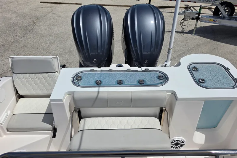 Slide: The Image of 2023 Sea Fox 288 Commander boat interior with dual engines and seating area. - 17