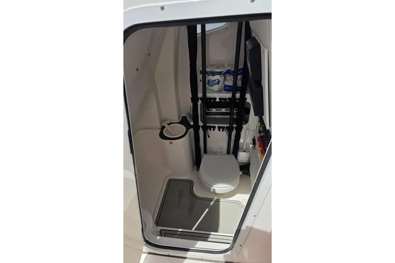 Slide: The Image of Interior of 2023 Sea Fox 288 Commander boat, featuring a compact marine toilet. - 20