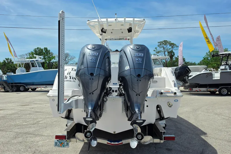 Slide: The Image of 2023 Sea Fox 288 Commander with dual Yamaha 300 V6 engines, displayed outdoors. - 4