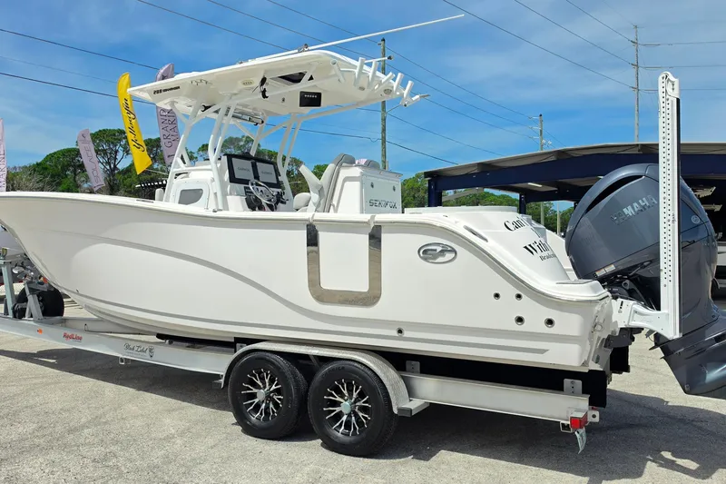 Slide: The Image of 2023 Sea Fox 288 Commander boat on trailer, featuring dual Yamaha engines. - 5