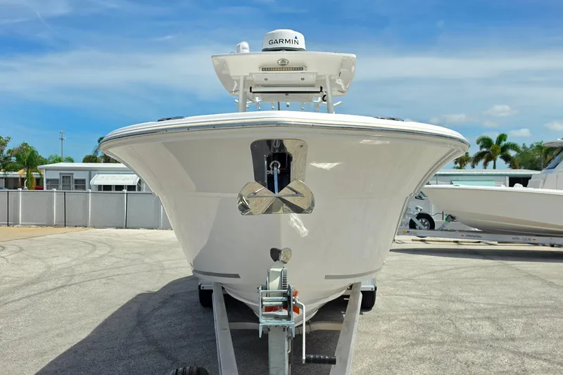 Slide: The Image of 2023 Sea Fox 288 Commander boat on trailer, front view, clear sky background. - 8